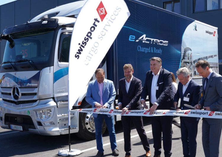 Swissport celebrates new Vienna cargo center with sustainability in focus / first e-truck cargo shuttle